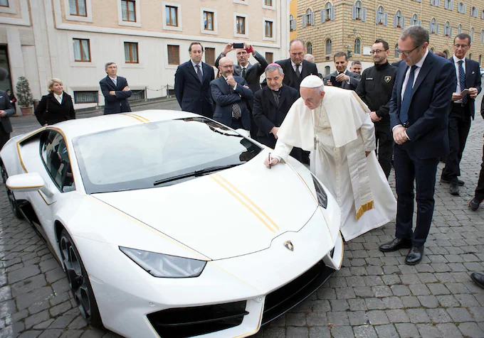 Pope Francis signing the Lamborghini at The Vatican in 2018